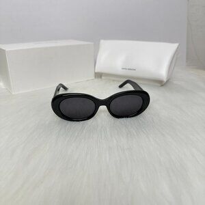 GENTLE MONSTER Sleek Black Oval Sunglasses